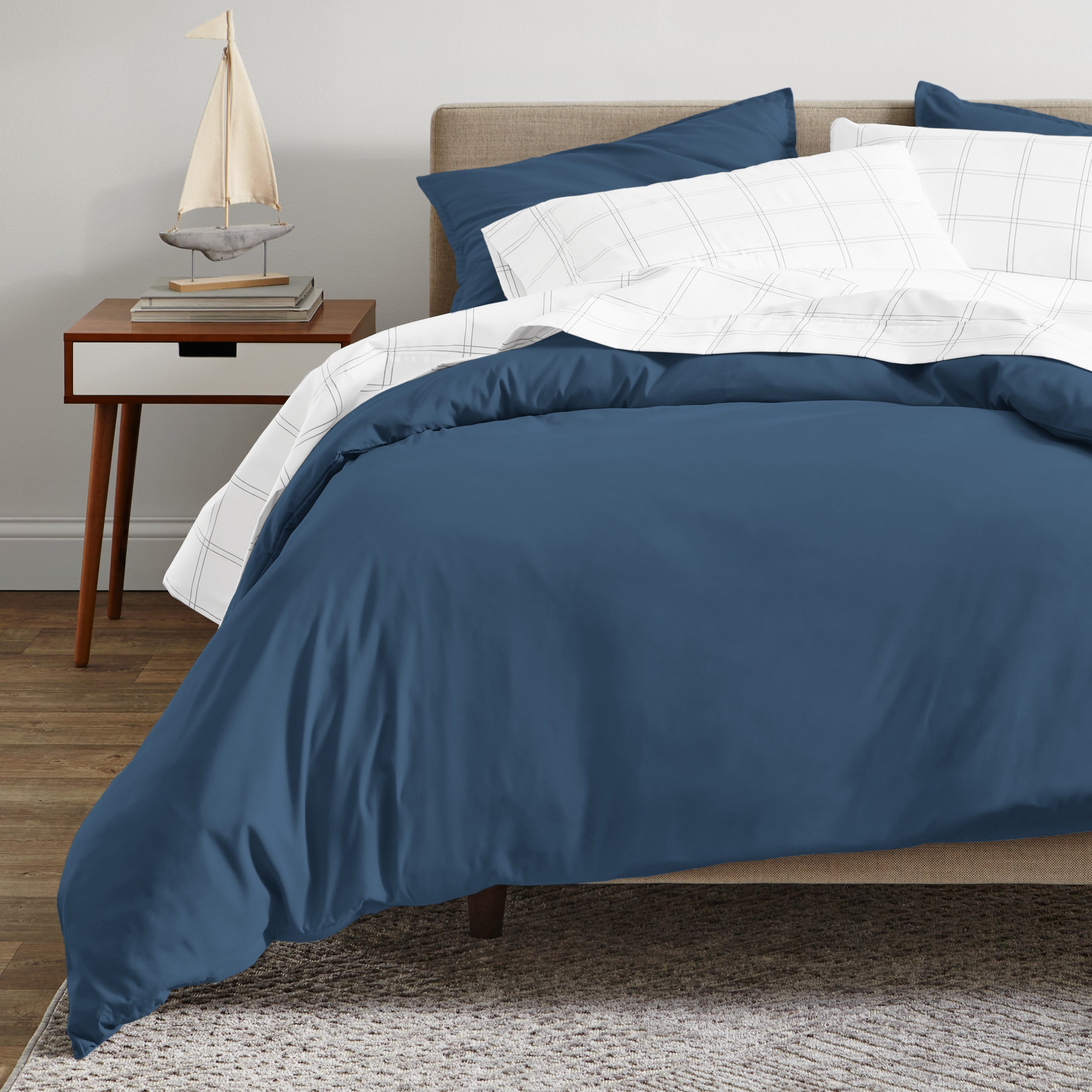 A modern bed with a organic sateen duvet cover set on.