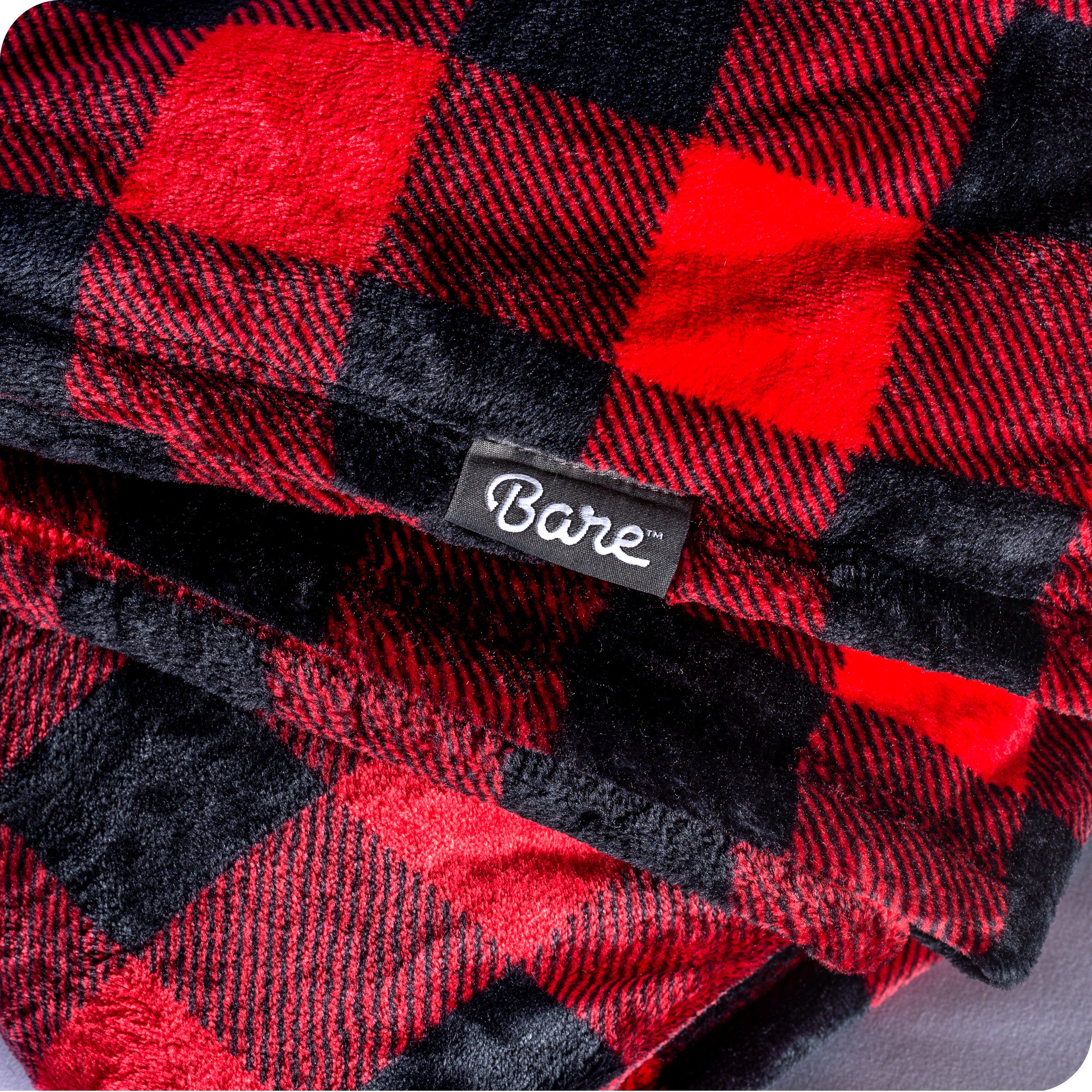 Close up of a plaid microplush blanket