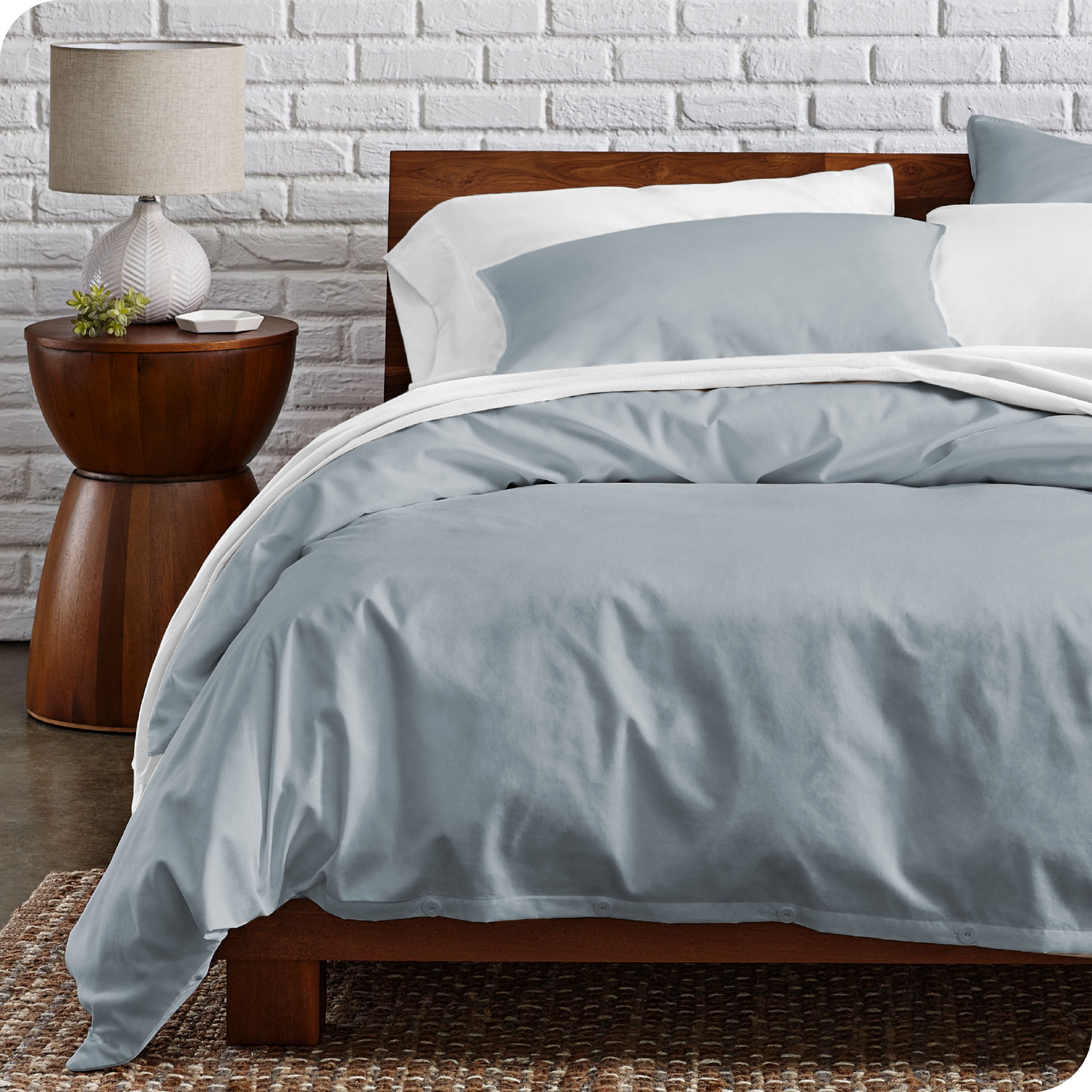 A modern bed with a organic cotton percale duvet cover on.