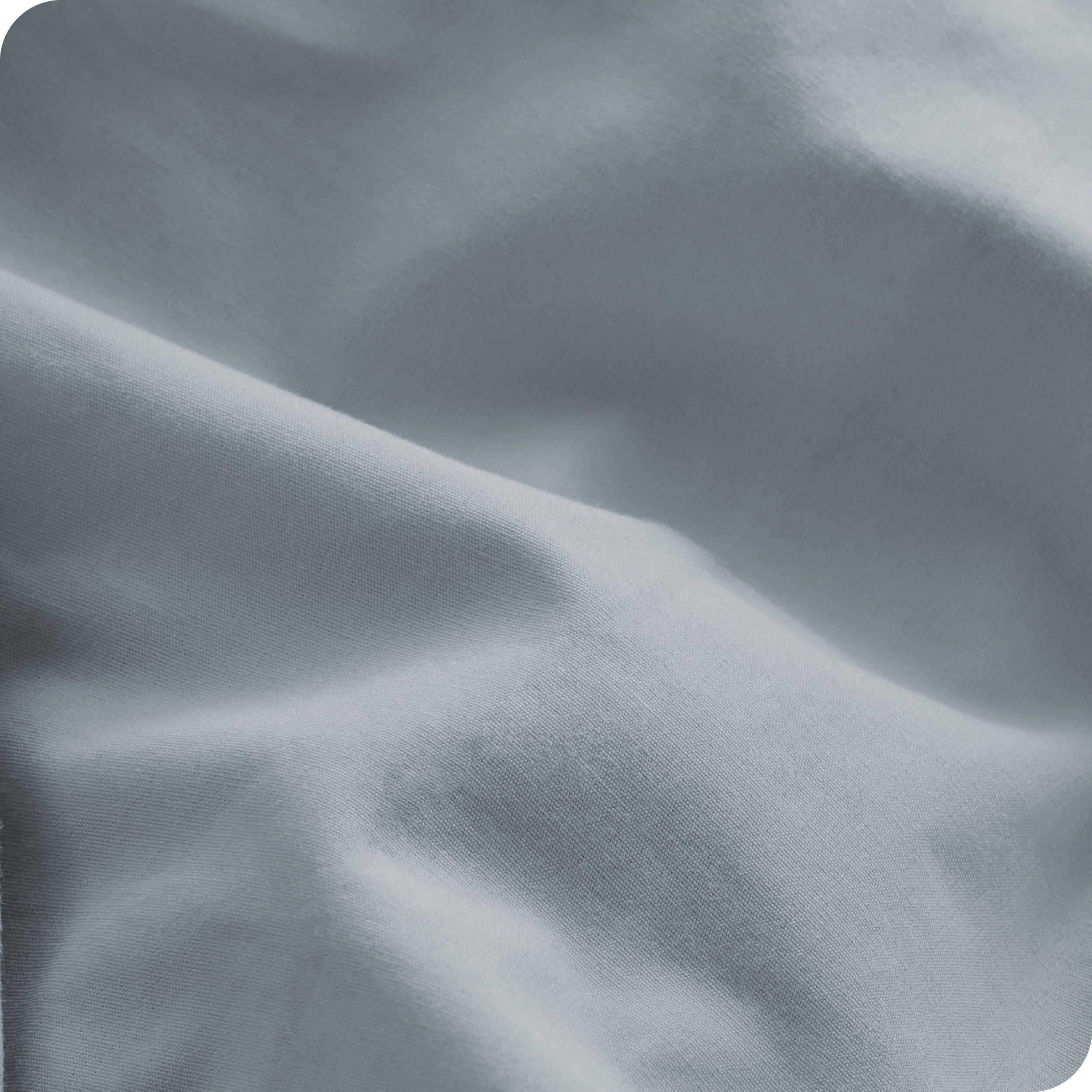 A close view of the oraganic cotton percale duvet cover showing the texture, color, and fabric.