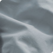 A close view of the oraganic cotton percale duvet cover showing the texture, color, and fabric.