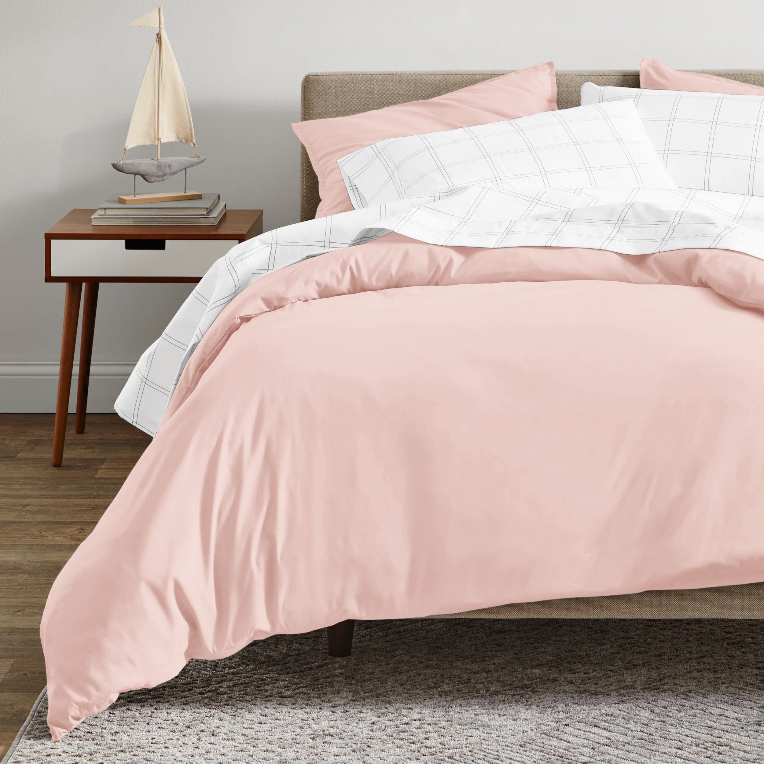 A modern bed with a organic sateen duvet cover set on.