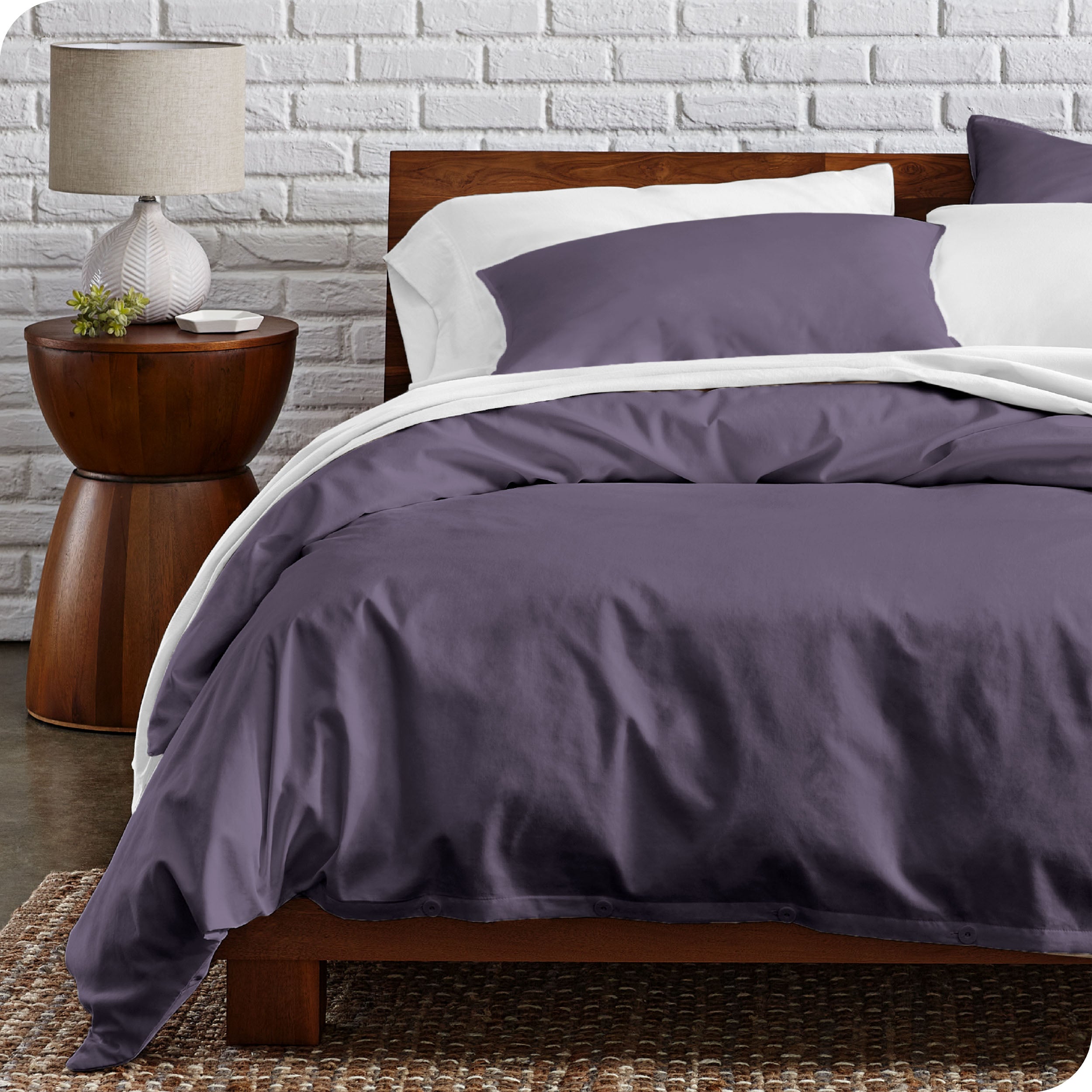 A modern bed with a organic cotton percale duvet cover on.