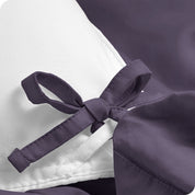 A close view of the corner tie of the duvet cover.