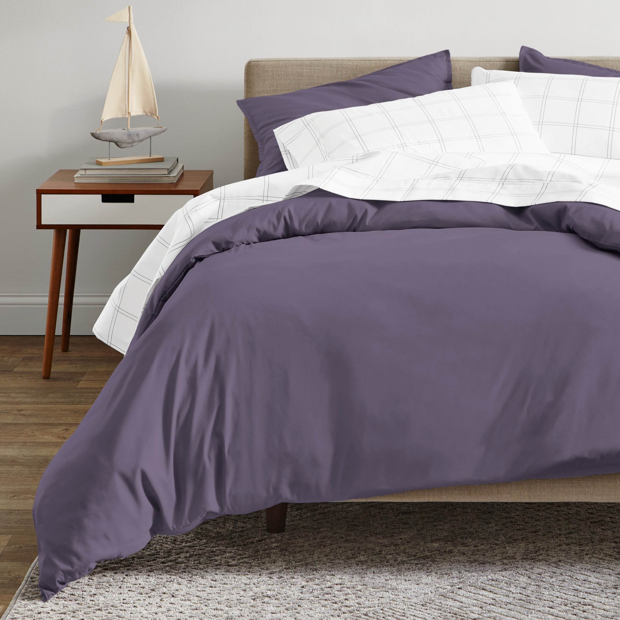 A modern bed with a organic sateen duvet cover set on.