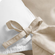 A close view of the corner tie of the duvet cover.