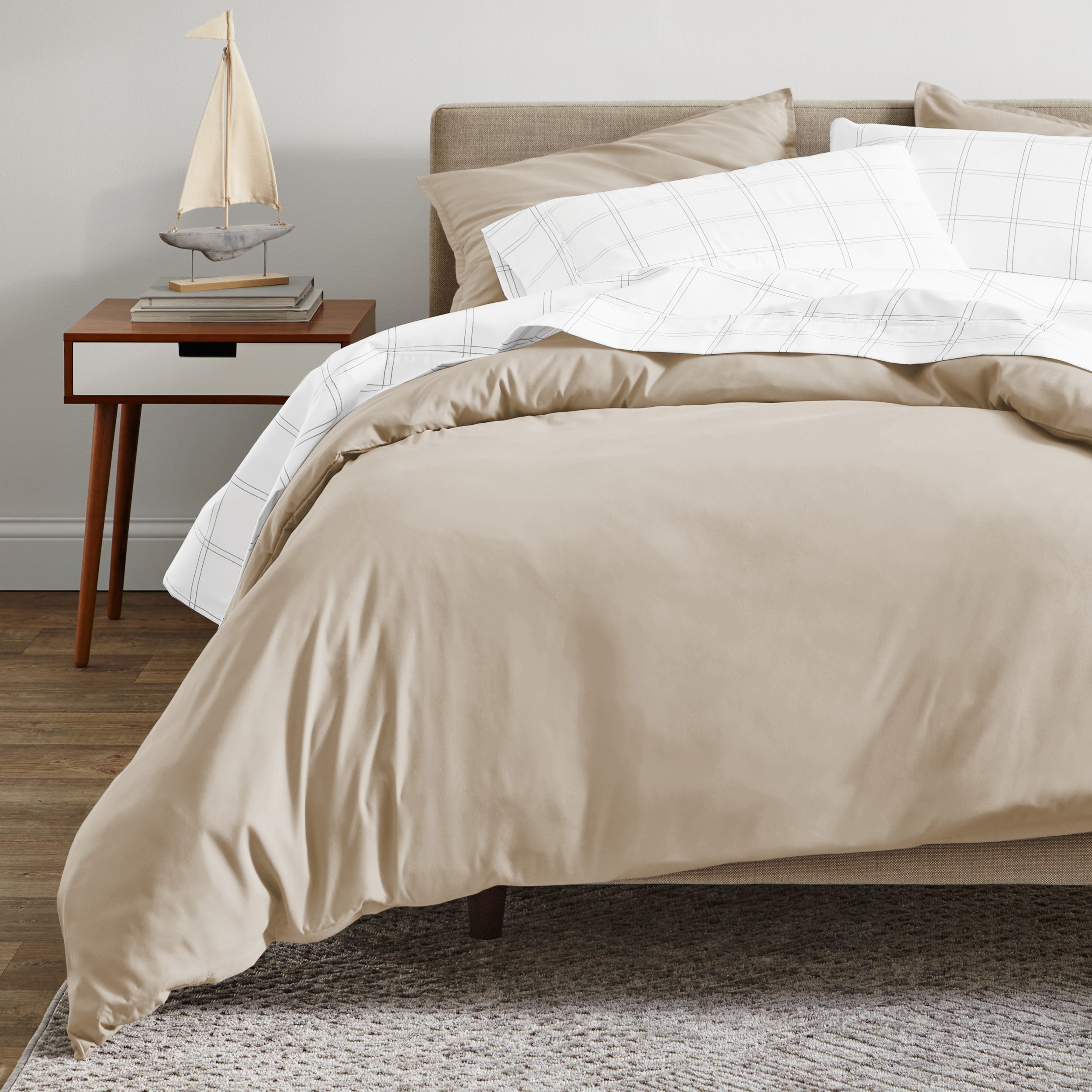 A modern bed with a organic sateen duvet cover set on.