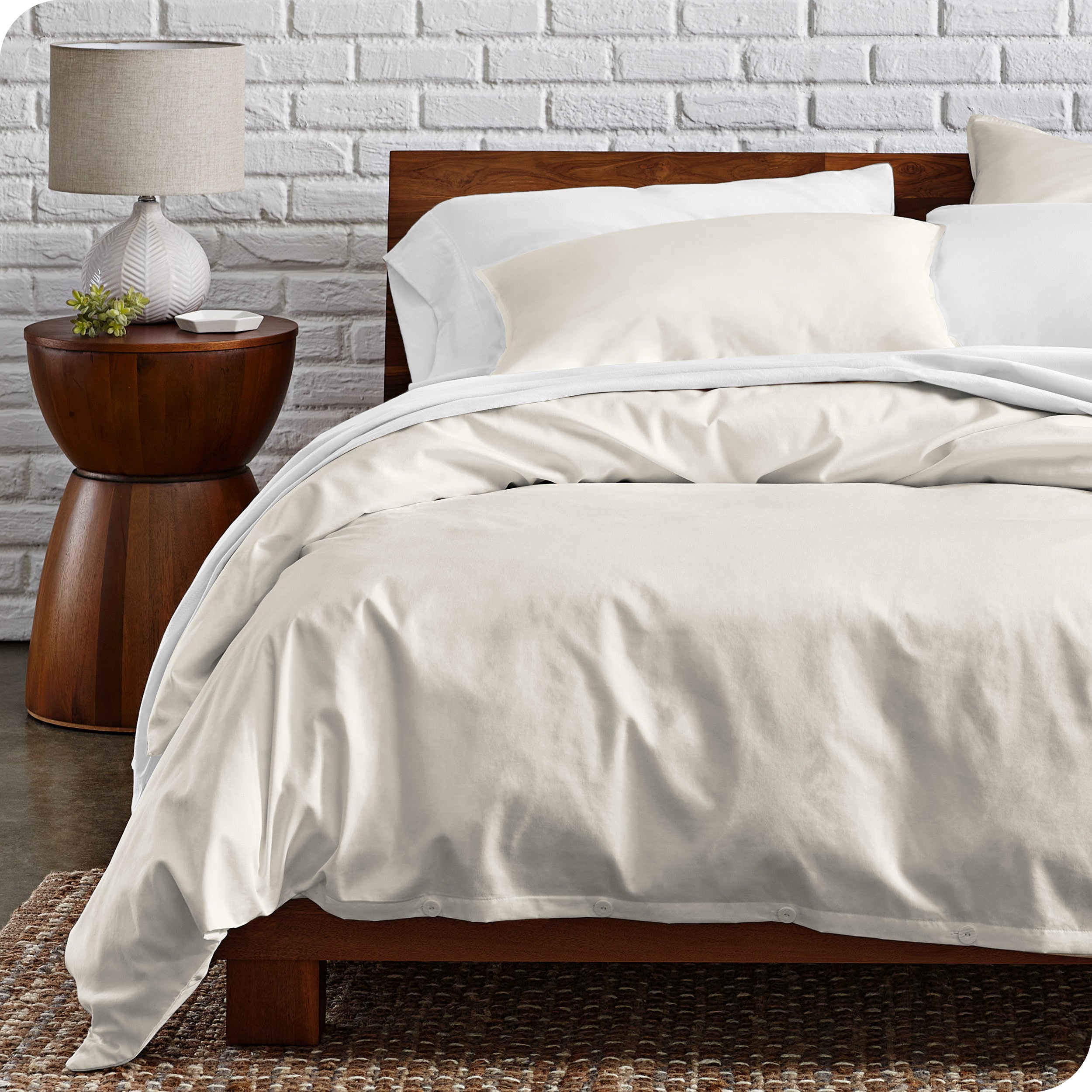 A modern bed with a organic cotton percale duvet cover on.