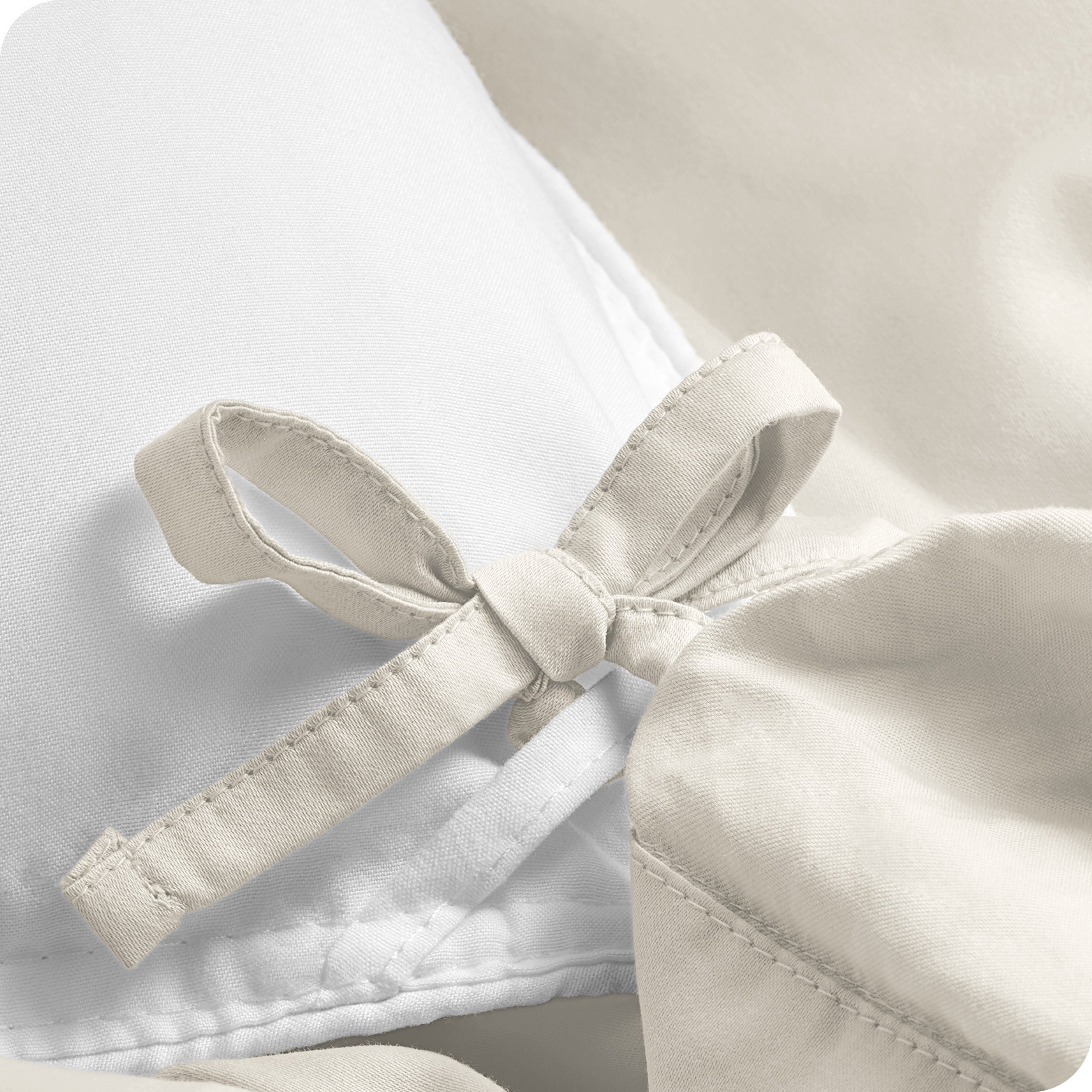 A close view of the corner tie of the duvet cover.
