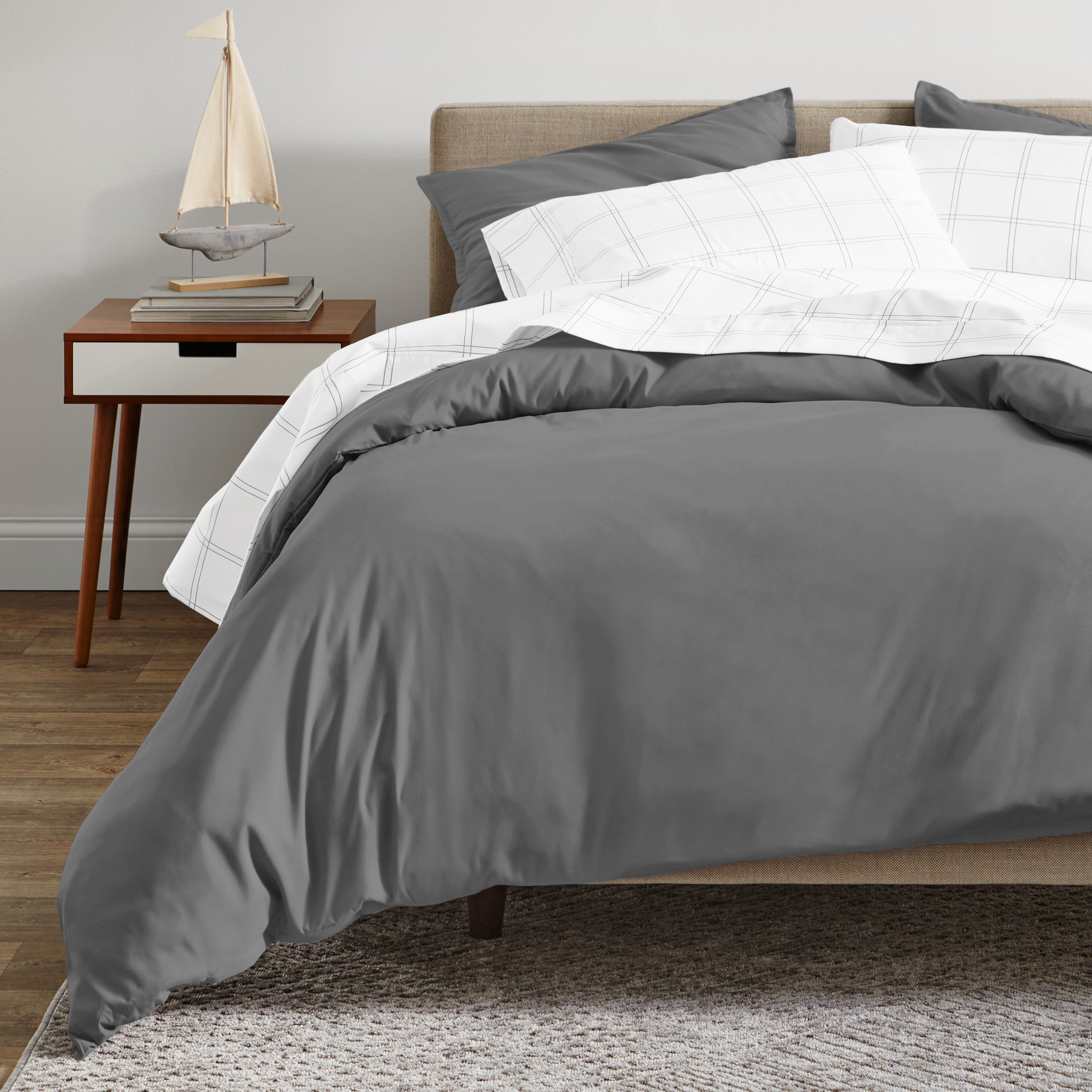 A modern bed with a organic sateen duvet cover set on.