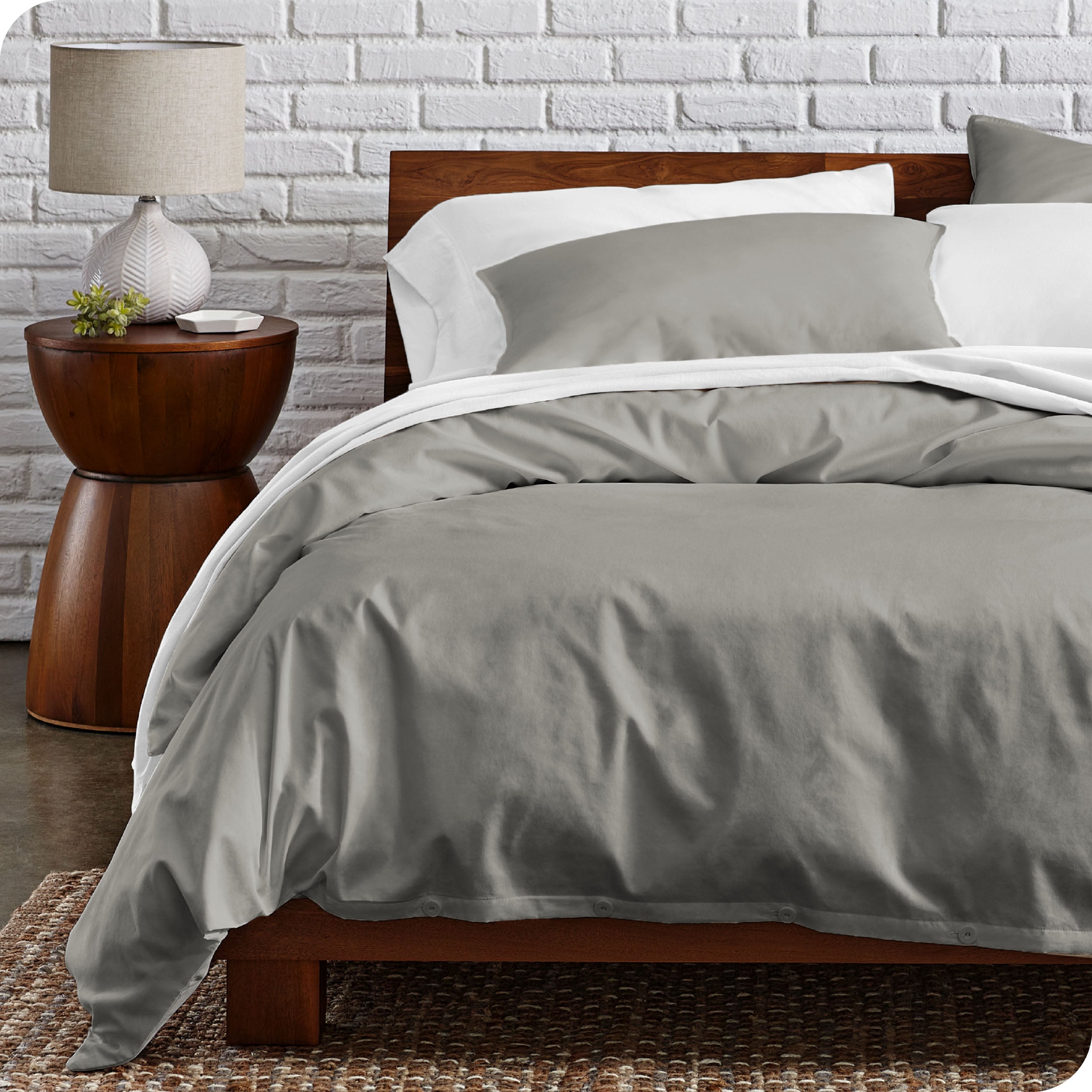 A modern bed with a organic cotton percale duvet cover on.