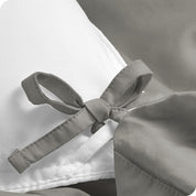 A close view of the corner tie of the duvet cover.
