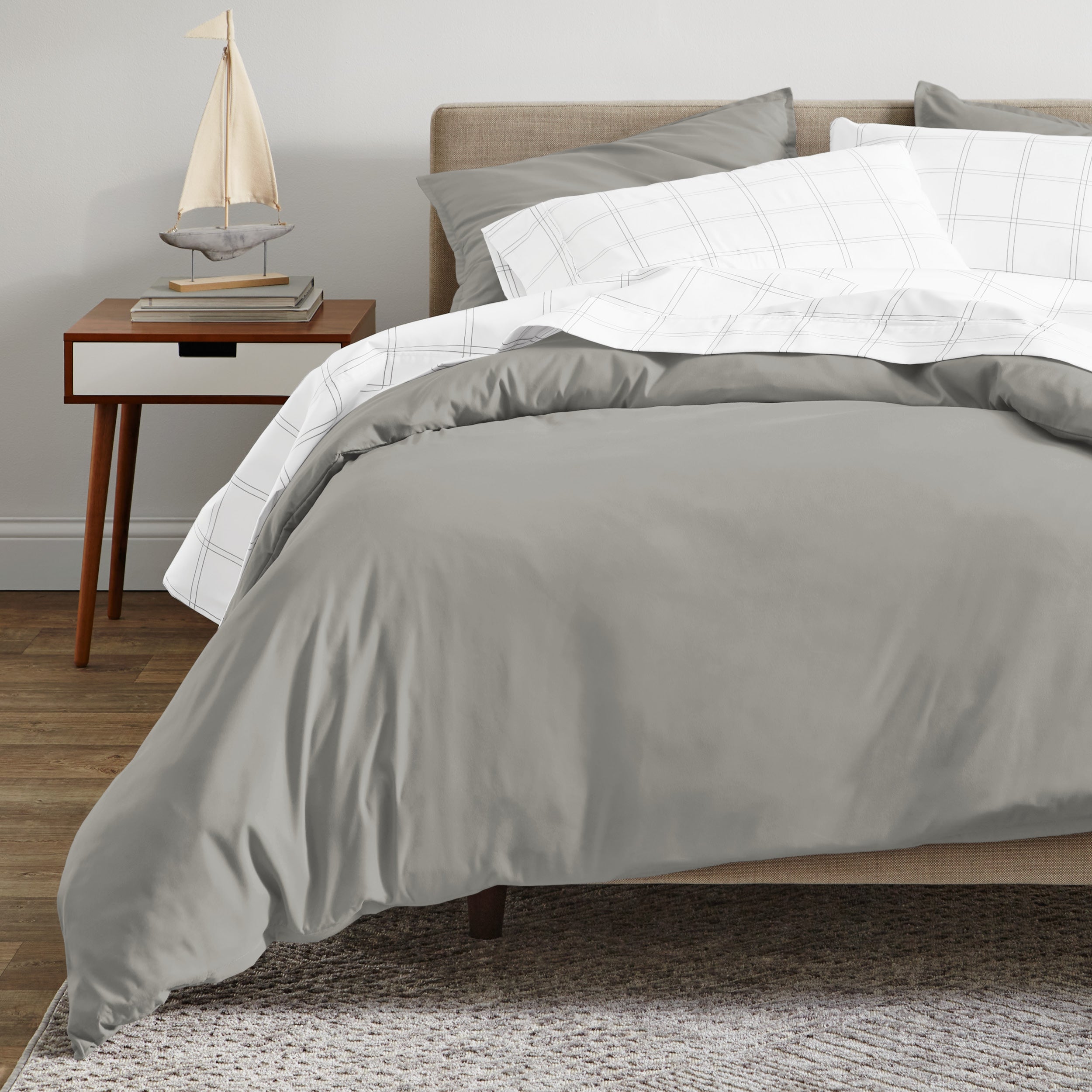 A modern bed with a organic sateen duvet cover set on.
