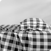 A side view of a bed with a pillow on top in our printed microfiber sheet set.