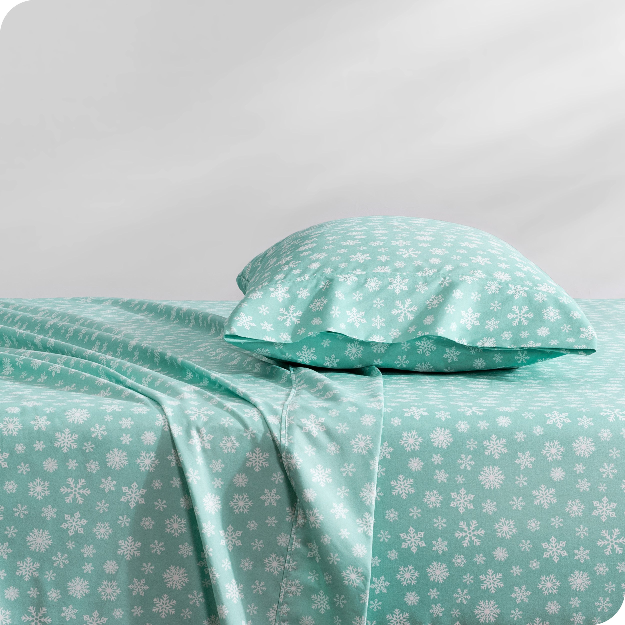 A side view of a bed with a pillow on top in our printed microfiber sheet set.