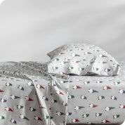 A side view of a bed with a pillow on top in our printed microfiber sheet set.