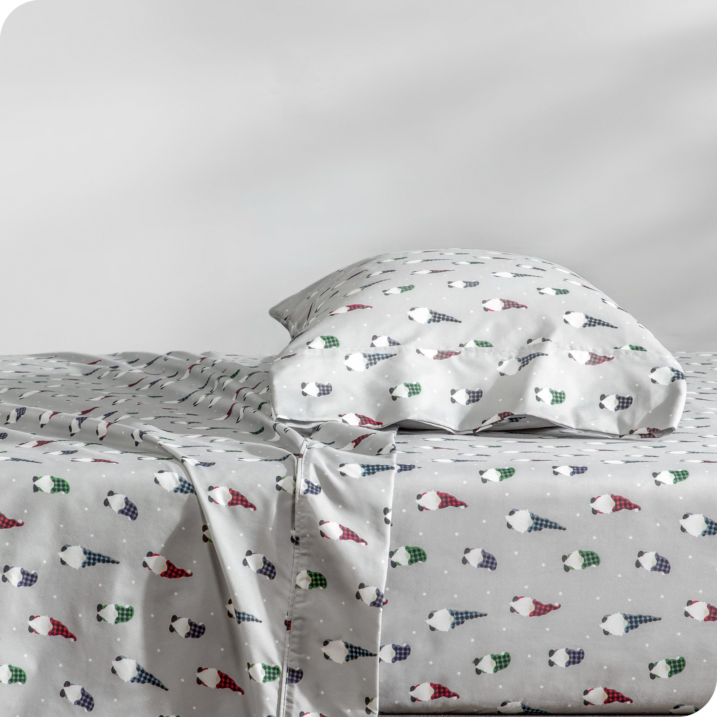 A side view of a bed with a pillow on top in our printed microfiber sheet set.