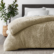 A sand shaggy duvet cover on a bed