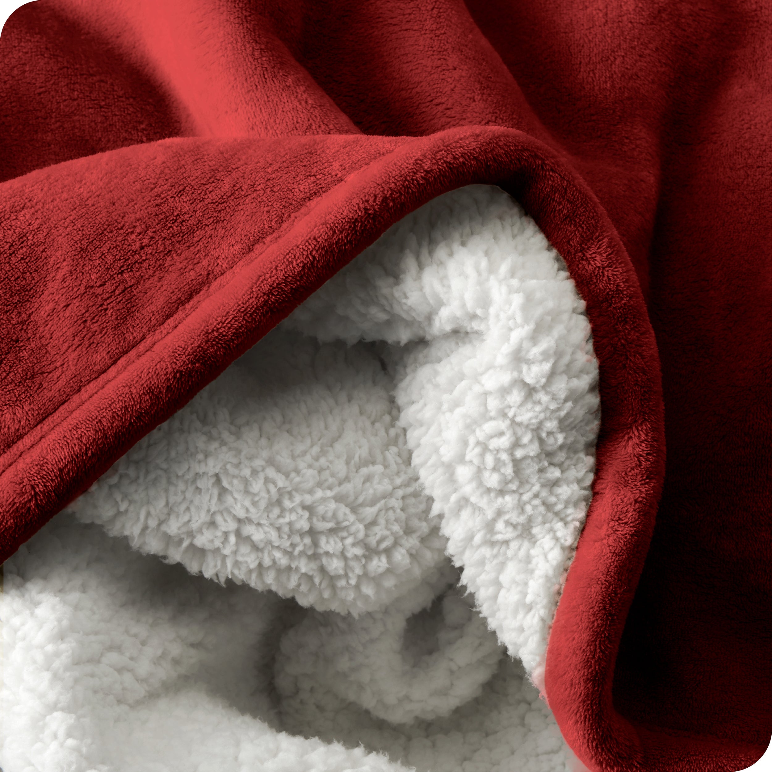 Close up of sherpa blanket showing texture of velvety soft side and sherpa backing