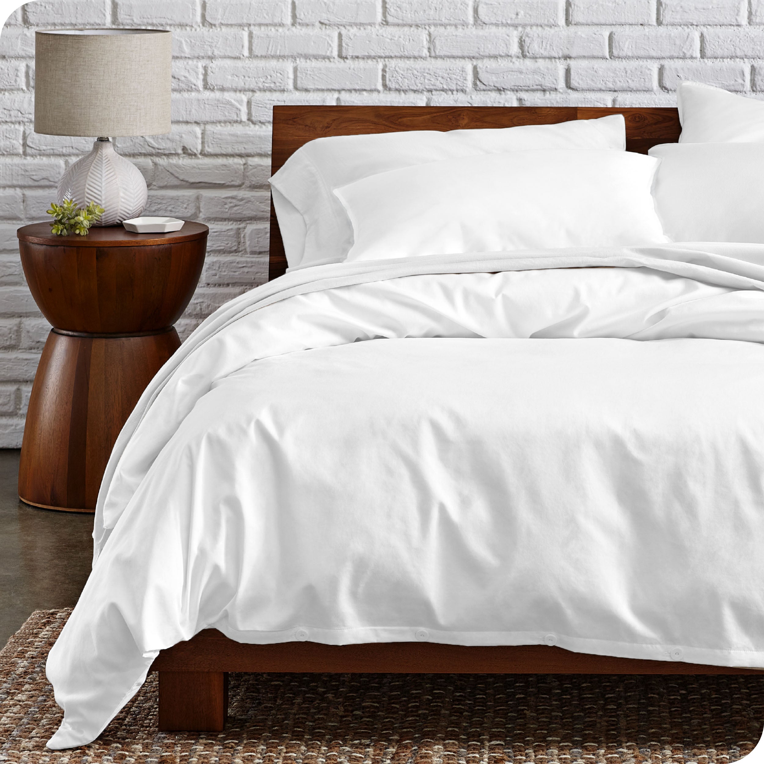 A modern bed with a organic cotton percale duvet cover on.