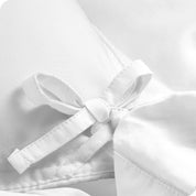 A close view of the corner tie of the duvet cover.