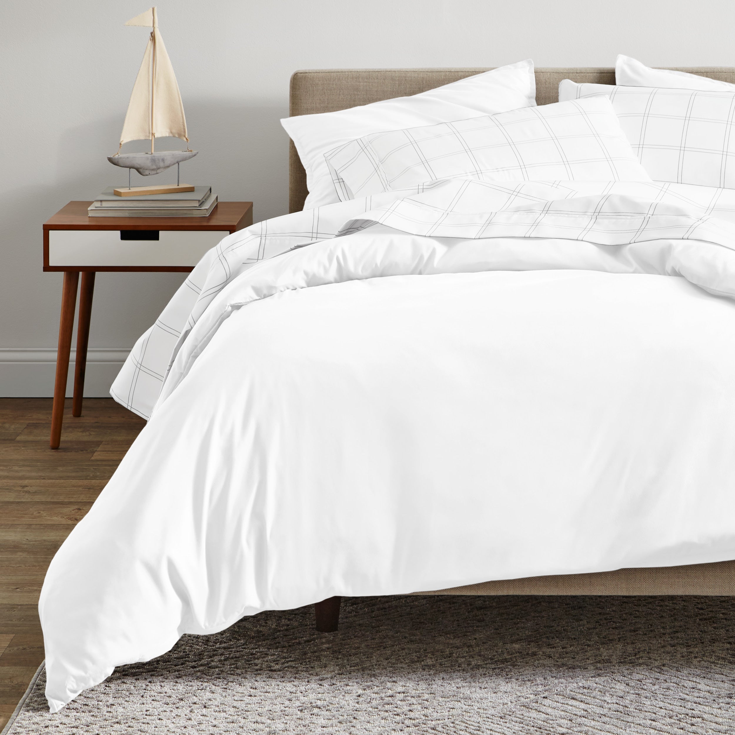 A modern bed with a organic sateen duvet cover set on.