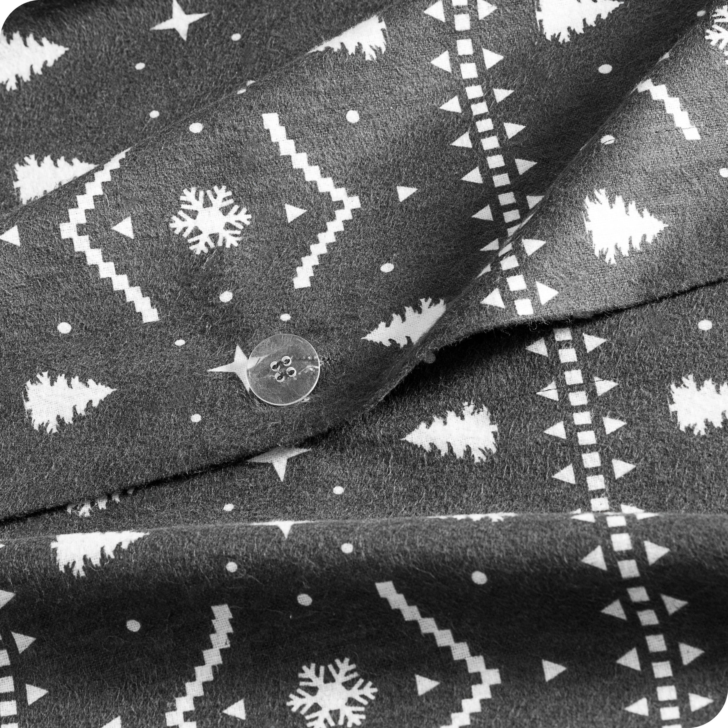 A close up of the flannel duvet cover showing the button, lining, texture, and pattern.