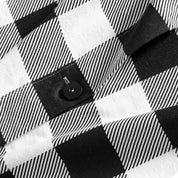 A close up of the flannel duvet cover showing the button, lining, texture, and pattern.