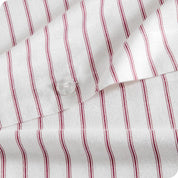 A close up of the flannel duvet cover showing the button, lining, texture, and pattern.